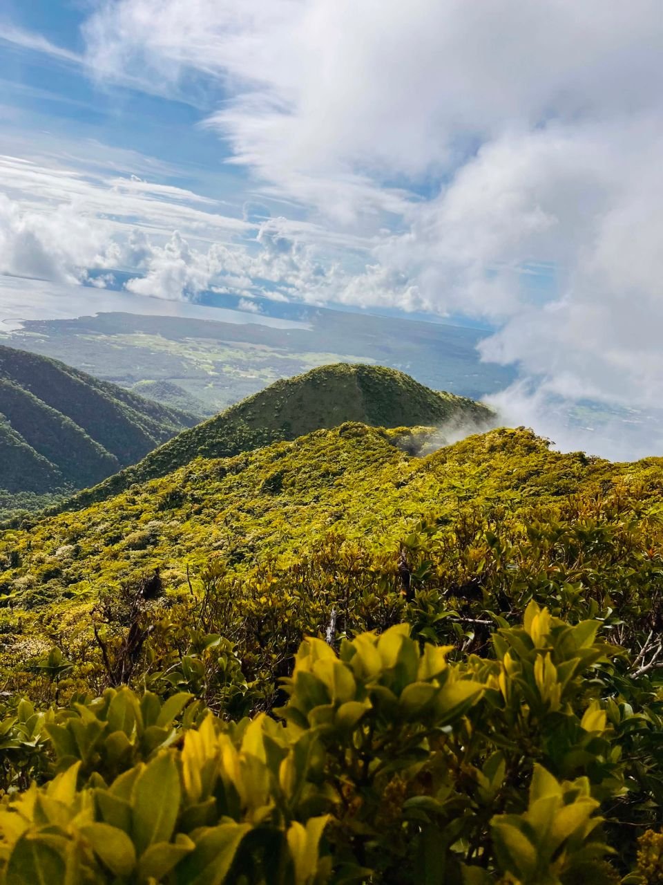 Green mountain ridges and clouds seen from the hike